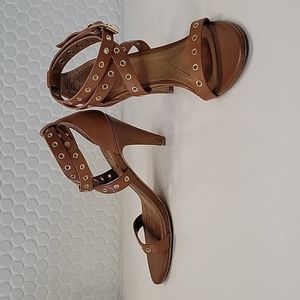 Brown leather heel with gold accents, size 7